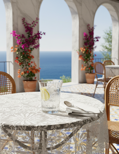 Altiera Tumbler with ice and lemon on a sunlit seaside terrace table