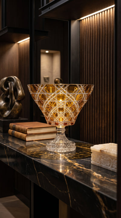 Sunlit Amber Verdura trumpet bowl on a black marble console