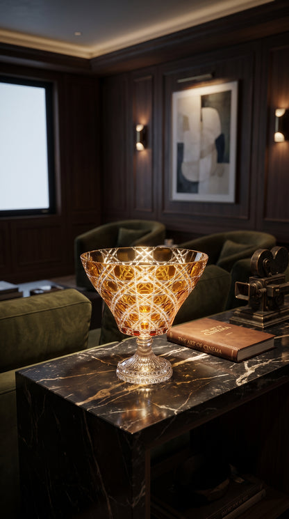 Sunlit Amber Verdura trumpet bowl on a dark marble lounge table
