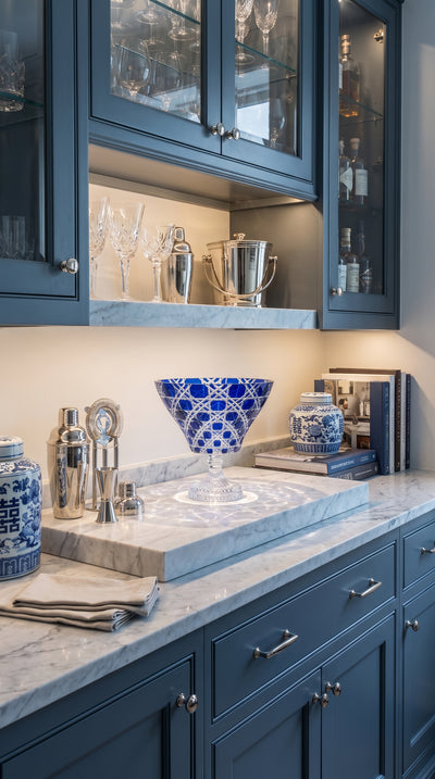 Verdura Midnight Sapphire trumpet bowl on a pale marble counter in a blue kitchen